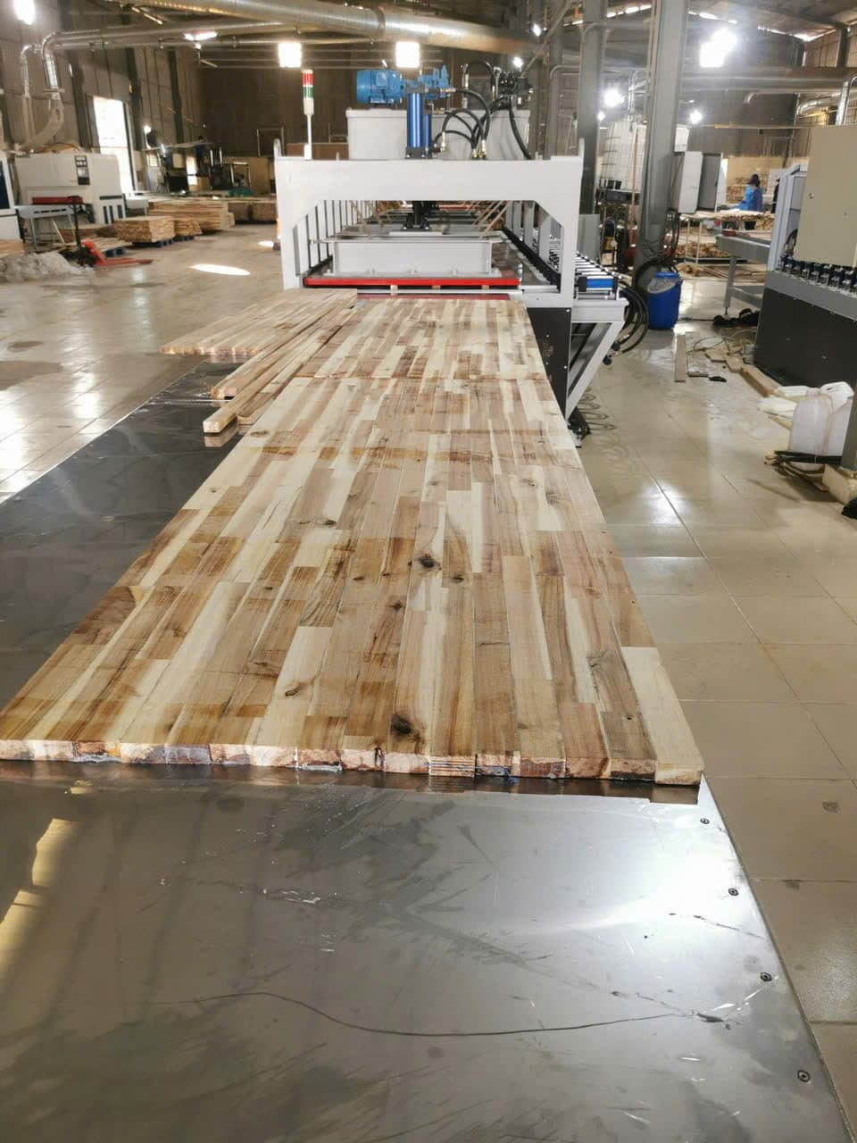 Workshop view of a U-frame high-frequency press being fabricated.