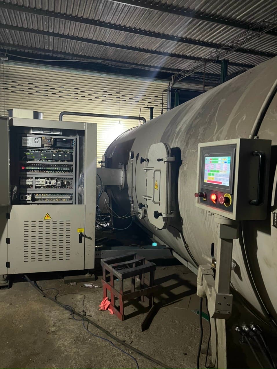 Technician monitoring HF kiln control screen