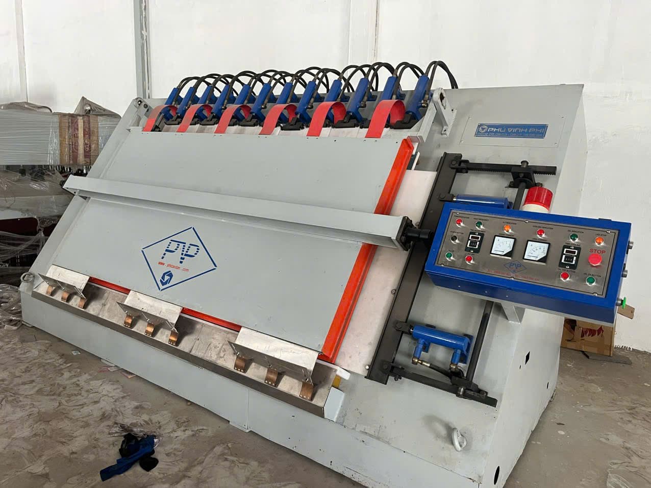 Operator aligning A-frame assembly in press