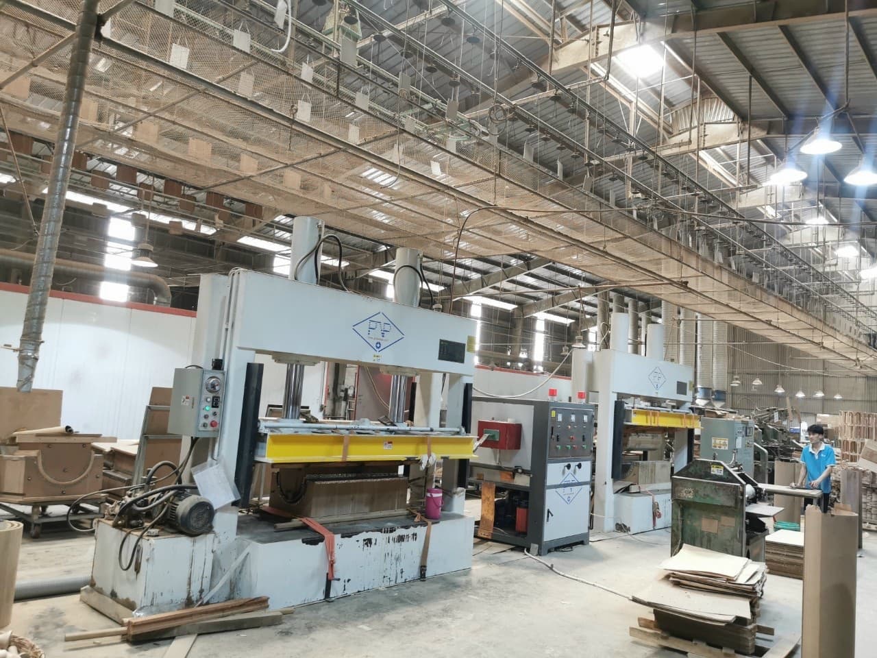 Technician adjusting frame press clamps